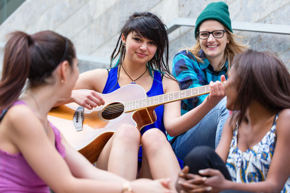 Girls playing guitar